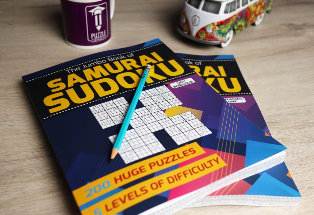 Two volumes of The Jumbo Book of Samurai Sudoku stacked