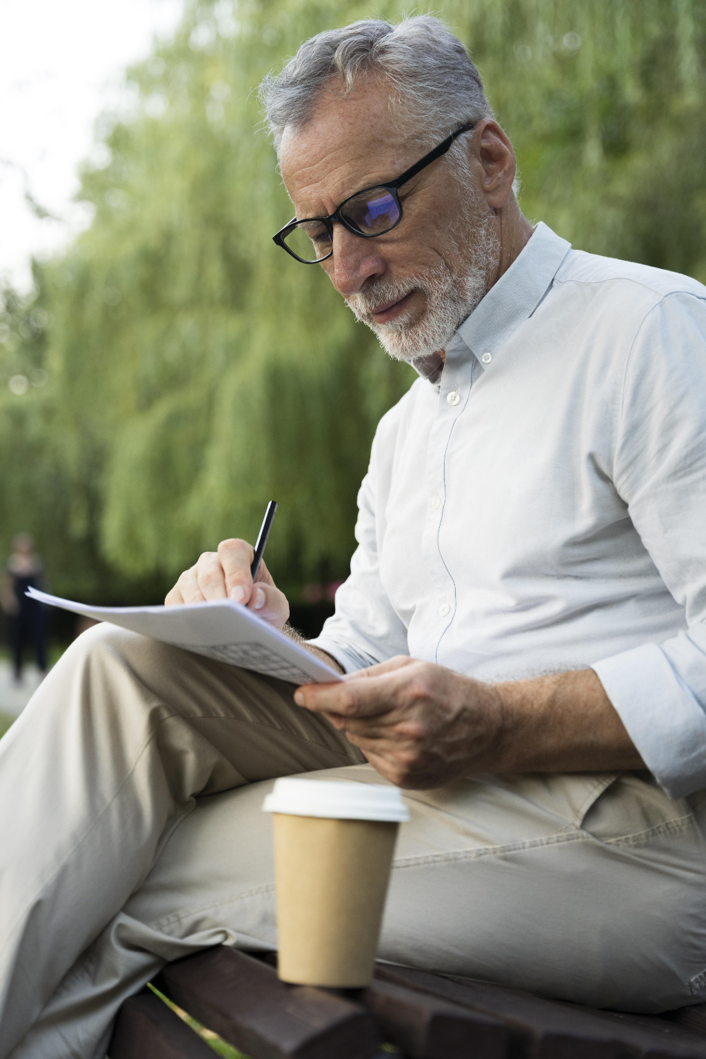 Man playing printed page of Puzzle Express